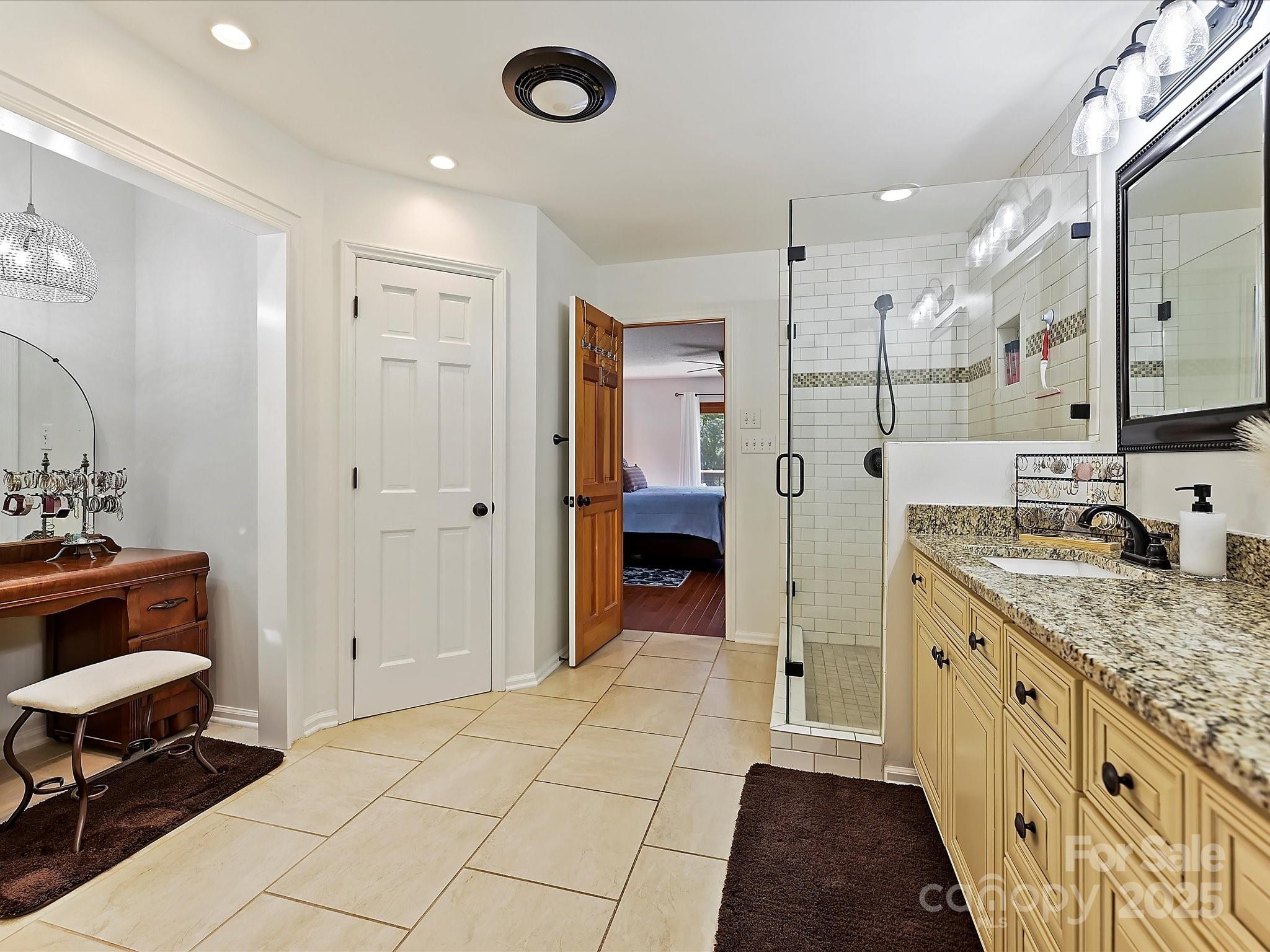 7146 Sifford Road Stanley, NC 28164 - Photo 19 of 42 a bathroom with a granite countertop sink and a mirror