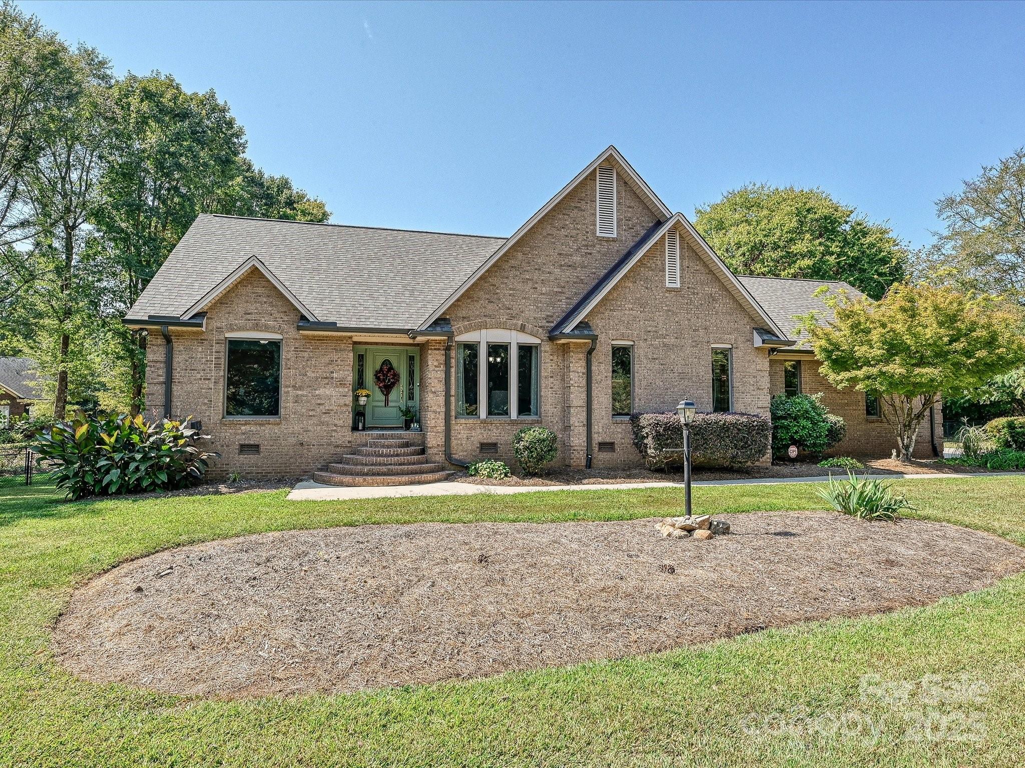 7146 Sifford Road Stanley, NC 28164 - Photo 2 of 42 a front view of a house with a yard and porch