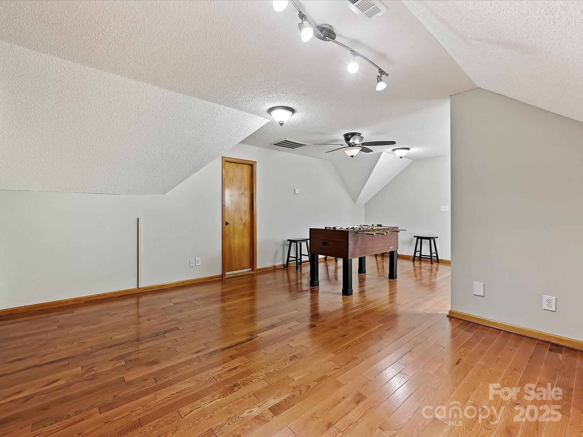 7146 Sifford Road Stanley, NC 28164 - Photo 25 of 42 a view of a room with wooden floor table and chairs