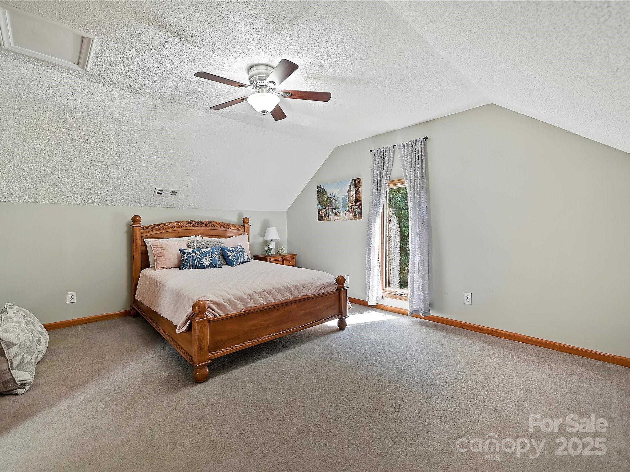 7146 Sifford Road Stanley, NC 28164 - Photo 27 of 42 a bedroom with a bed and window