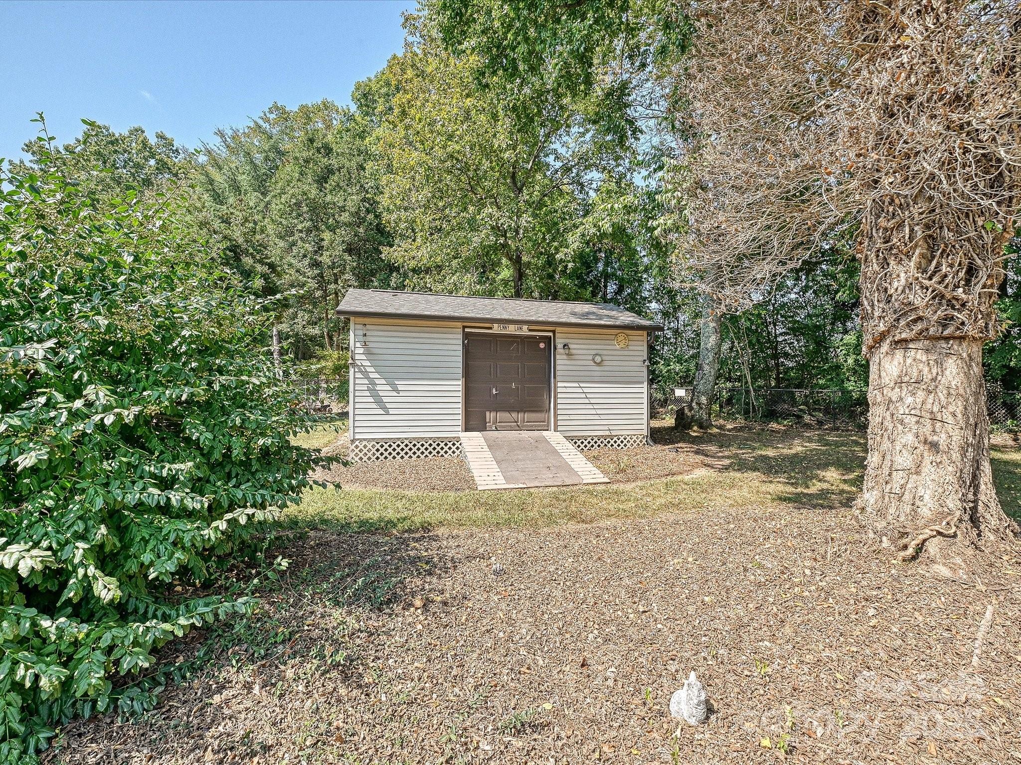 7146 Sifford Road Stanley, NC 28164 - Photo 34 of 42 a view of a house with a yard and large tree