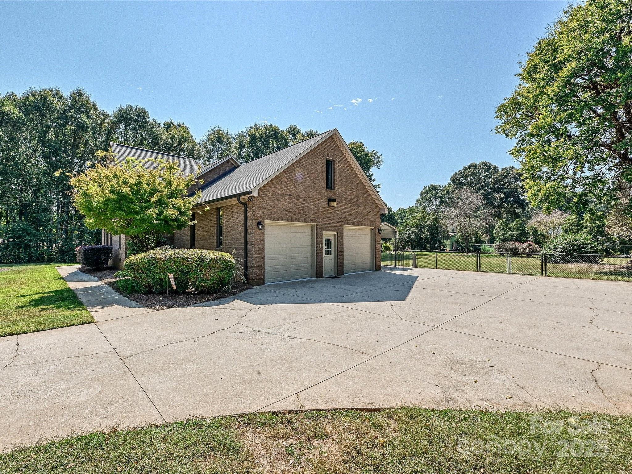 7146 Sifford Road Stanley, NC 28164 - Photo 36 of 42 a front view of a house with a yard and potted plants