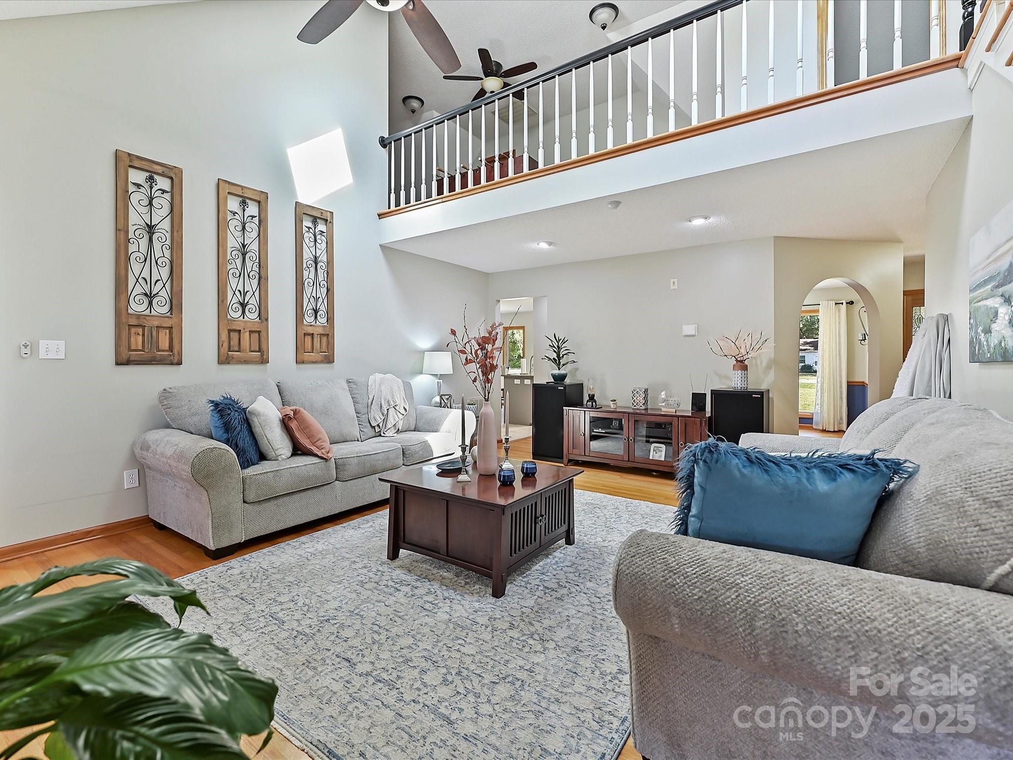 7146 Sifford Road Stanley, NC 28164 - Photo 7 of 42 a living room with furniture and a chandelier