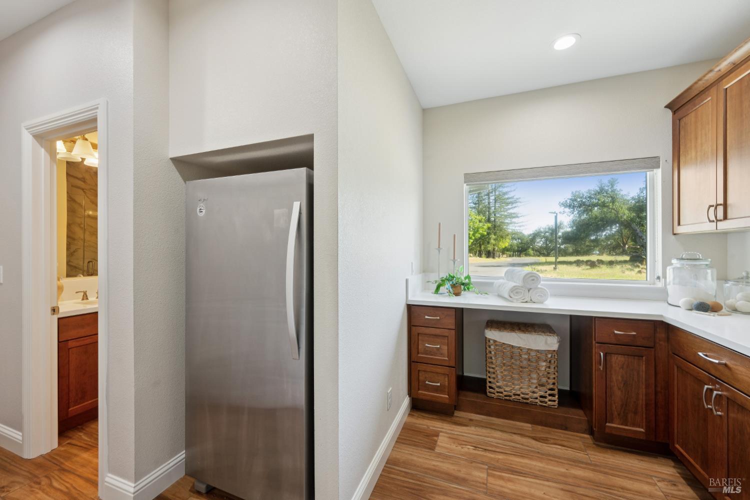4665 Upper Ridge Road Santa Rosa, CA 95404 - Photo 24 of 71 a kitchen with stainless steel appliances a large window and a refrigerator