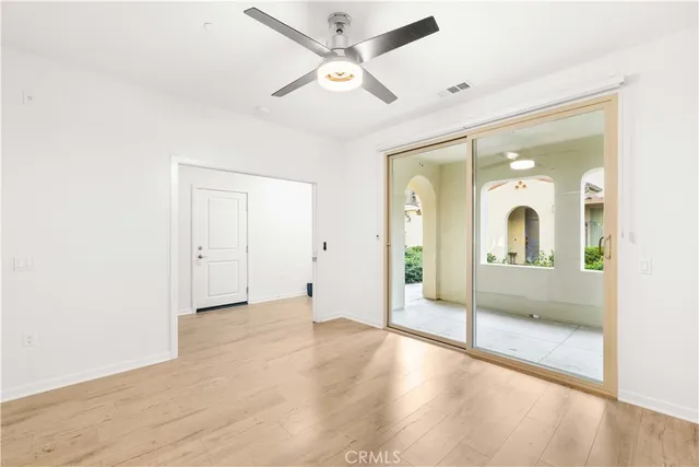 a view of livingroom with hardwood floor and a ceiling fan