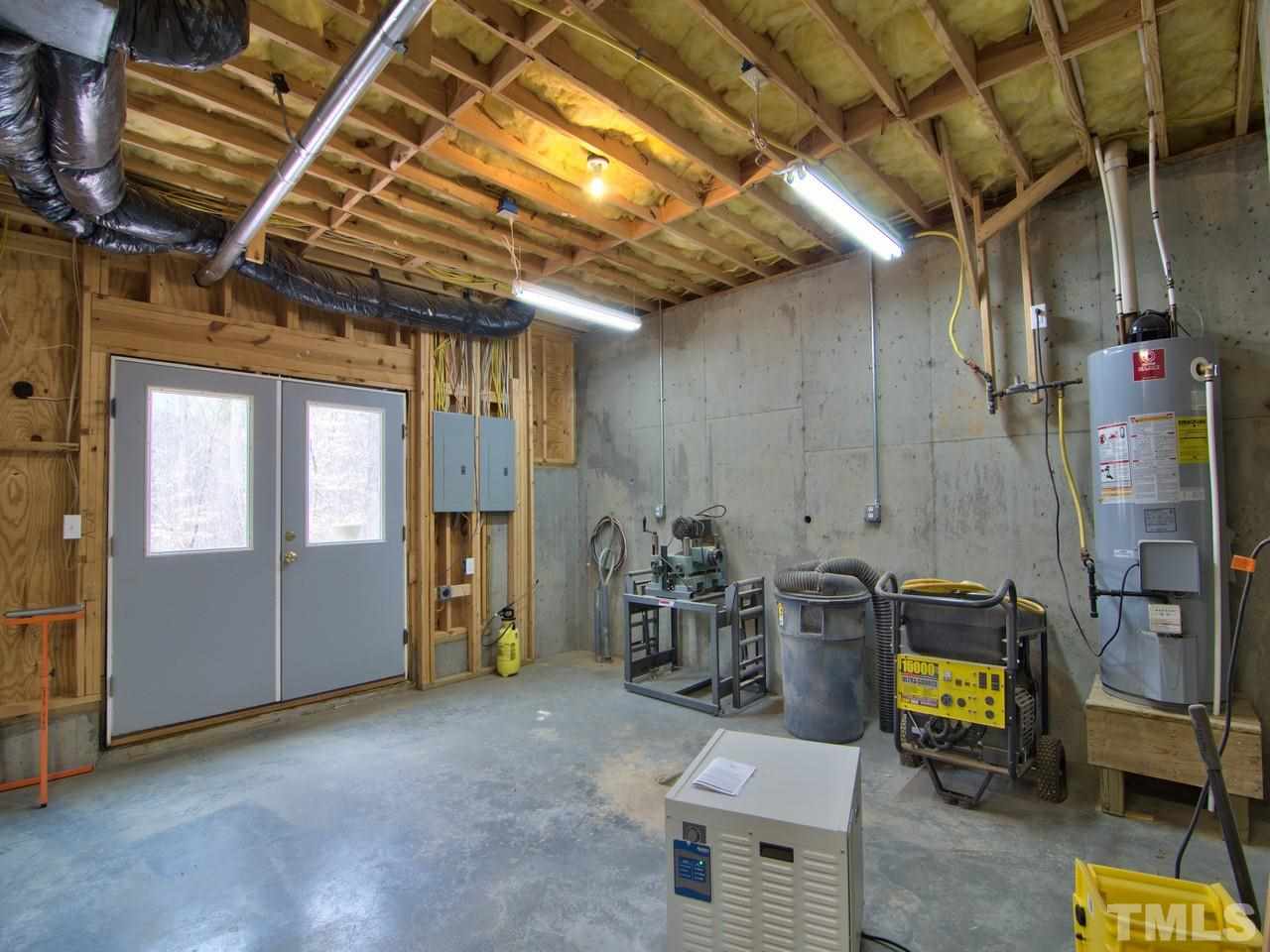 301 Booth Road Chapel Hill, NC 27516 - Photo 22 of 25 The double doors are incredibly handy if you want to use this as a workshop. Or if you are a gardener--what a great place to haul things in and out! There is also a perfect place to install a wine cellar, if that's your interest.