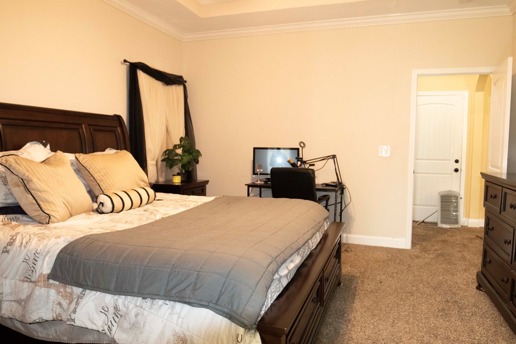 147 McLendon Road Fort Mitchell, AL 36856 - Photo 13 of 17 a bedroom with a bed and a flat screen tv