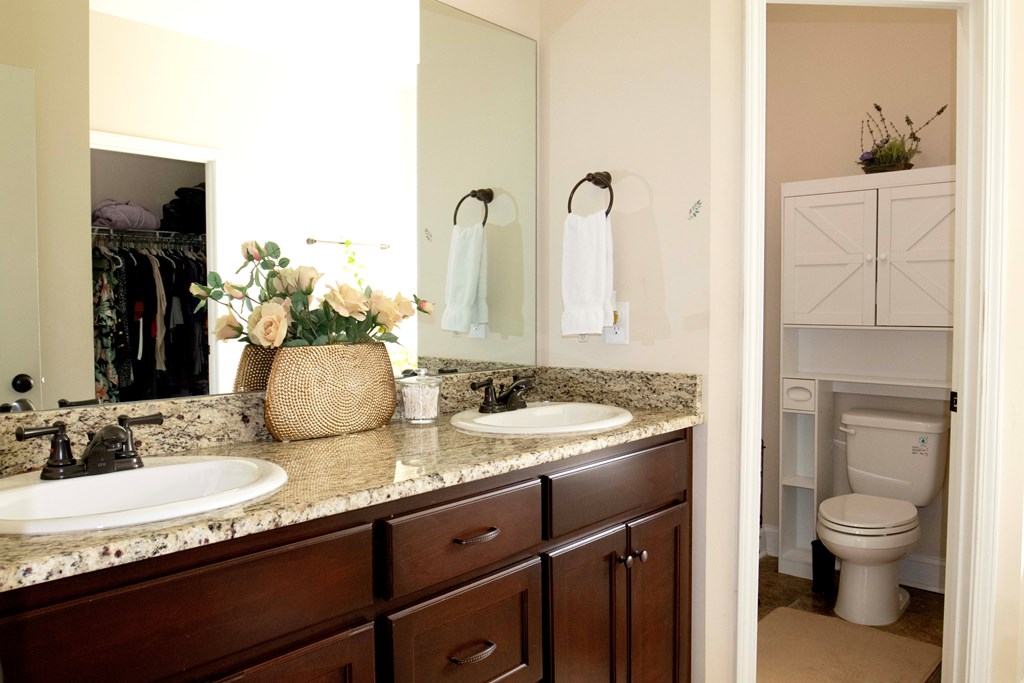 147 McLendon Road Fort Mitchell, AL 36856 - Photo 15 of 17 a bathroom with a granite countertop sink toilet and mirror