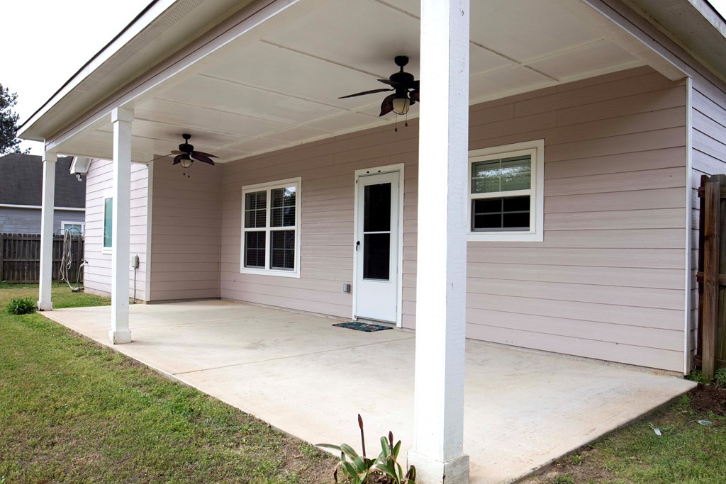 147 McLendon Road Fort Mitchell, AL 36856 - Photo 16 of 17 a view of house with backyard and glass windows