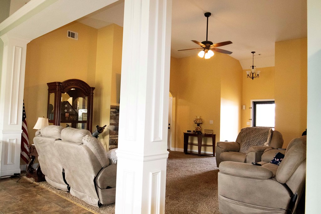 147 McLendon Road Fort Mitchell, AL 36856 - Photo 5 of 17 a view of living room with furniture and a chandelier