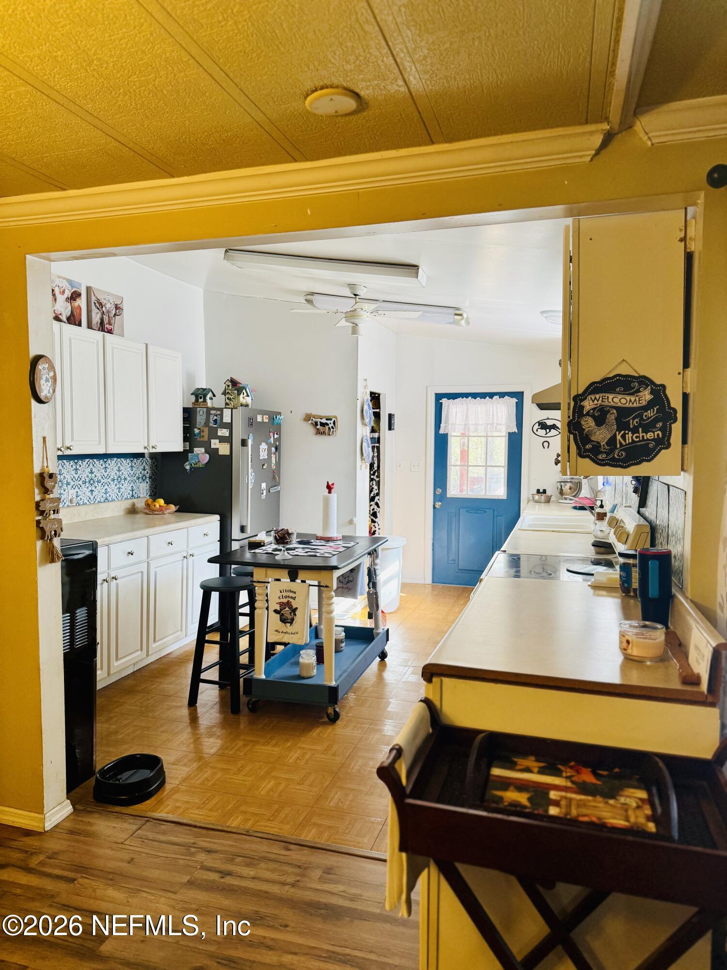 4700 Berry Court Keystone Heights, FL 32656 - Photo 12 of 65 a living room with furniture a rug and a table