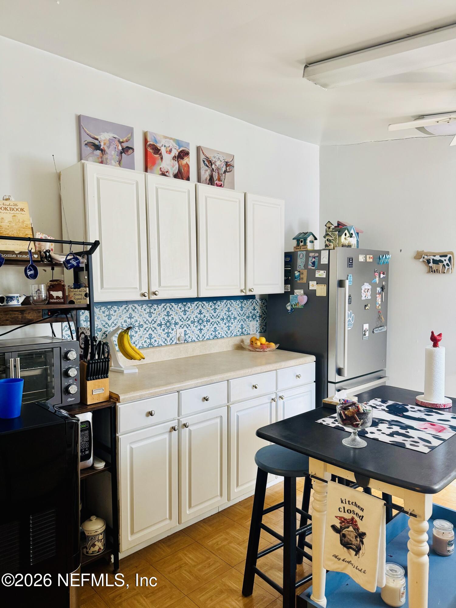 4700 Berry Court Keystone Heights, FL 32656 - Photo 14 of 65 a kitchen with a stove and a refrigerator