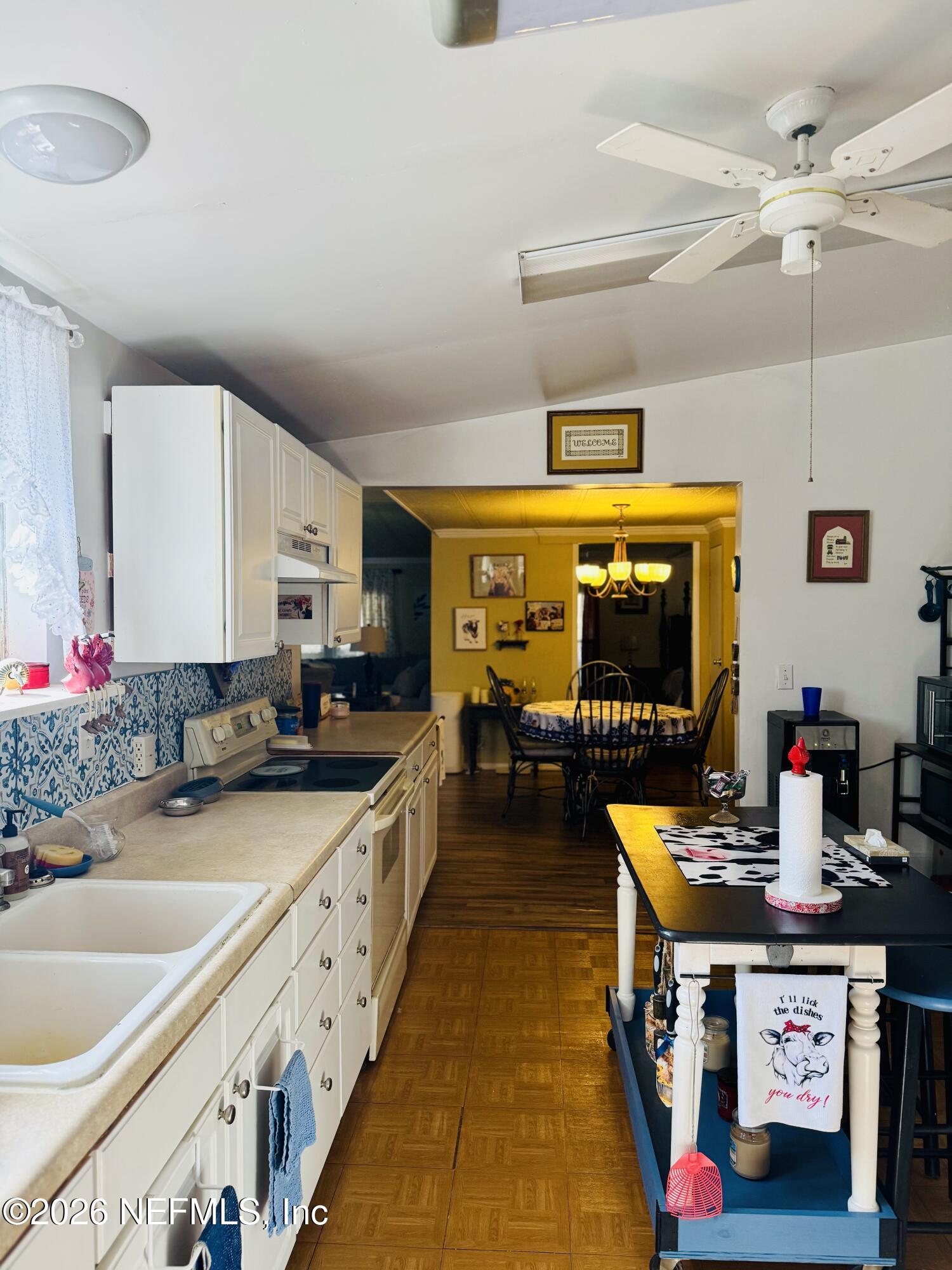4700 Berry Court Keystone Heights, FL 32656 - Photo 16 of 65 a kitchen with stove a sink and a refrigerator