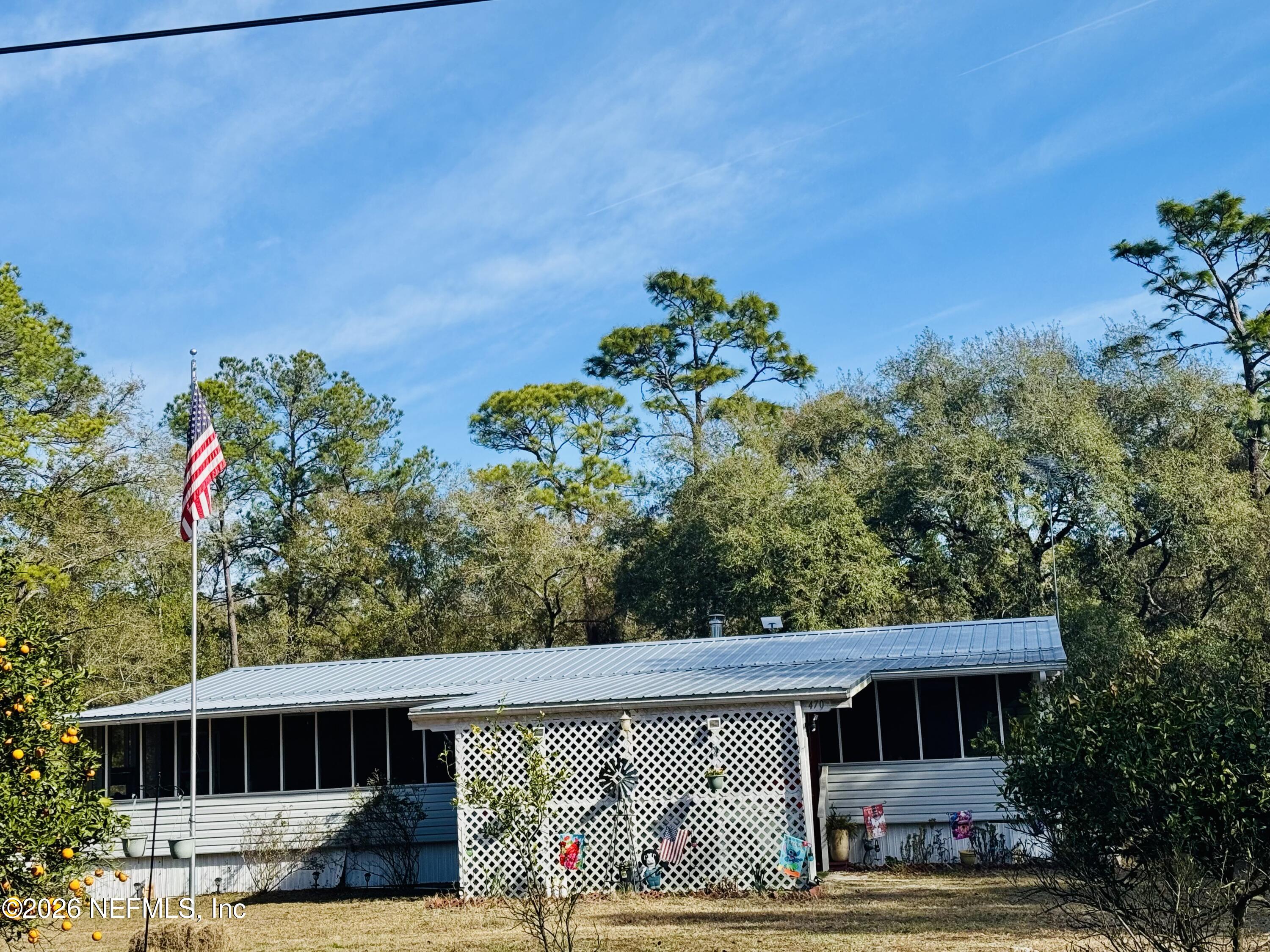 4700 Berry Court Keystone Heights, FL 32656 - Photo 2 of 65 a front view of a house with garden