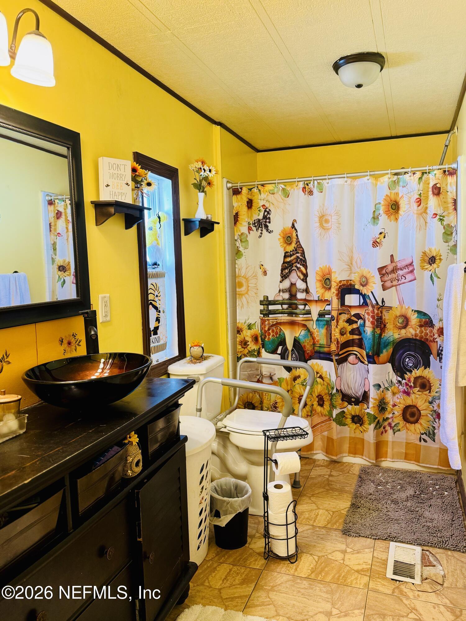 4700 Berry Court Keystone Heights, FL 32656 - Photo 24 of 65 a bathroom with a sink mirror and a shower