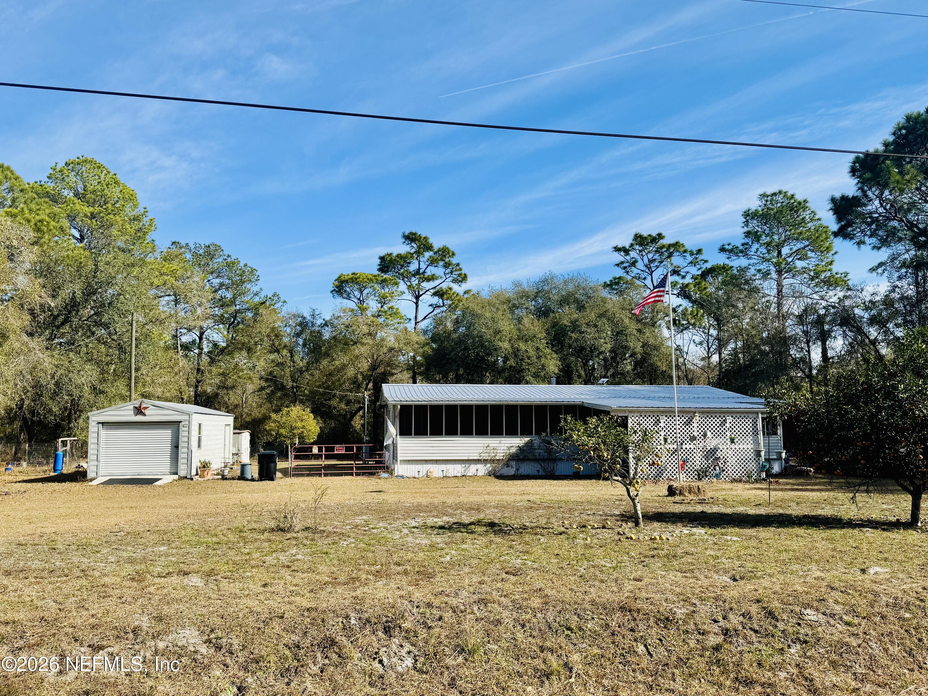 4700 Berry Court Keystone Heights, FL 32656 - Photo 3 of 65 a view of a house with a swimming pool