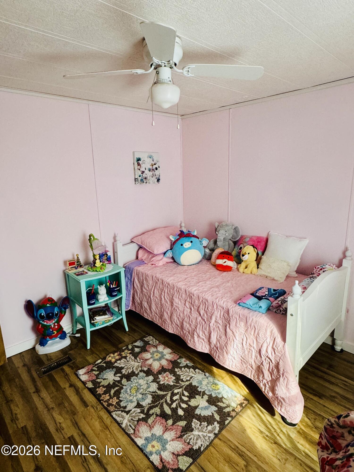 4700 Berry Court Keystone Heights, FL 32656 - Photo 36 of 65 a bedroom with a bed and a dresser in it