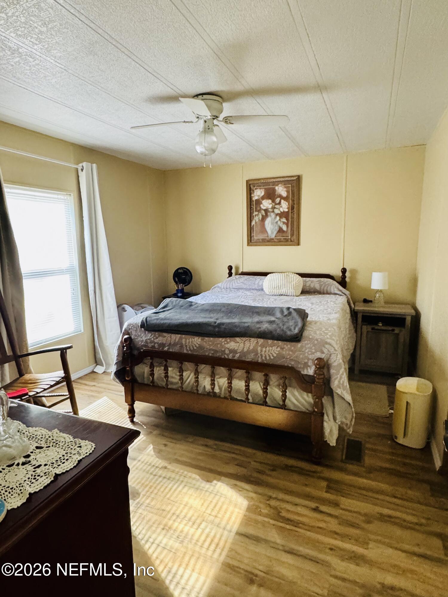 4700 Berry Court Keystone Heights, FL 32656 - Photo 40 of 65 a bedroom with a bed and a window