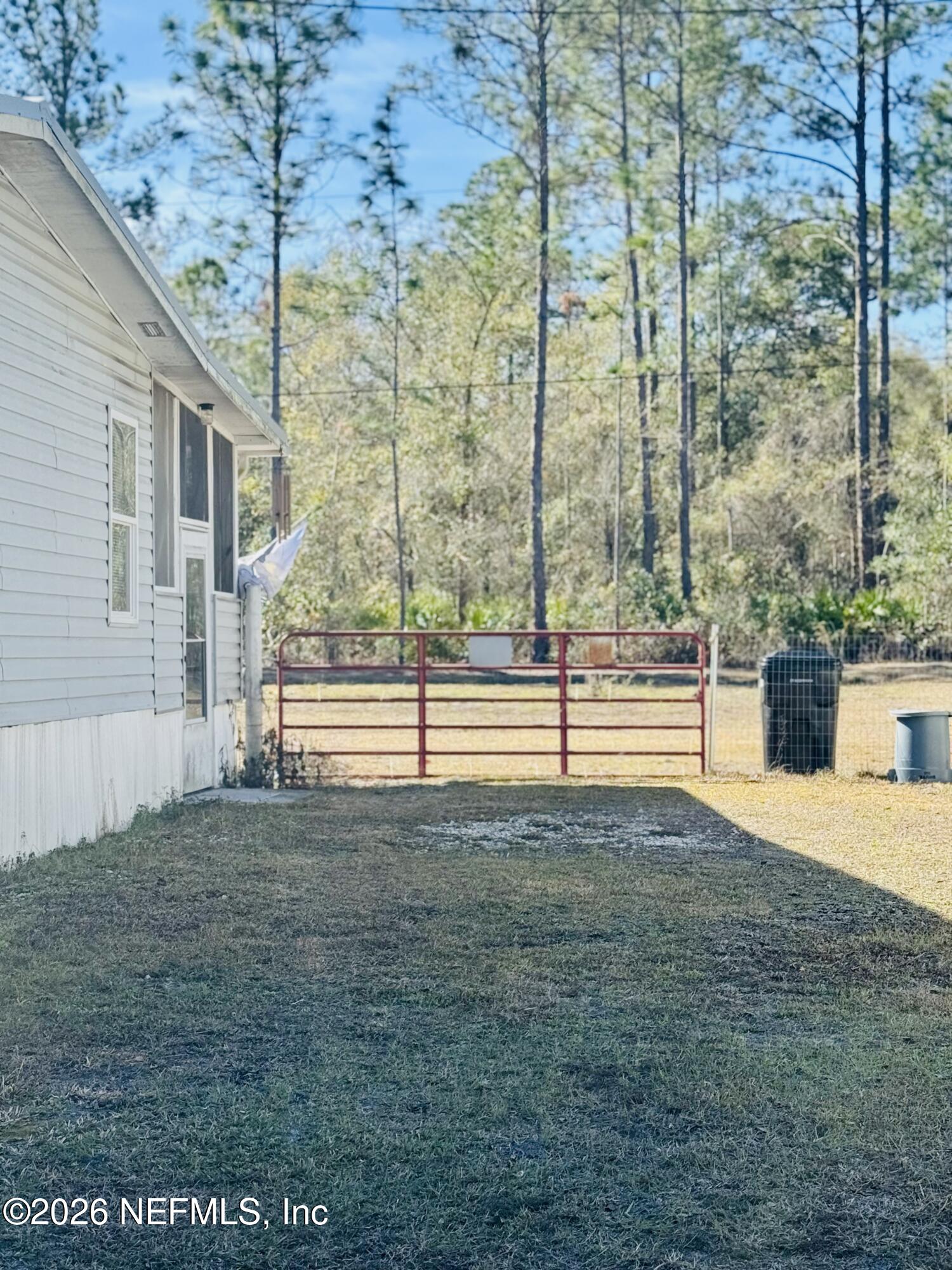 4700 Berry Court Keystone Heights, FL 32656 - Photo 54 of 65 a view of a yard with an empty space