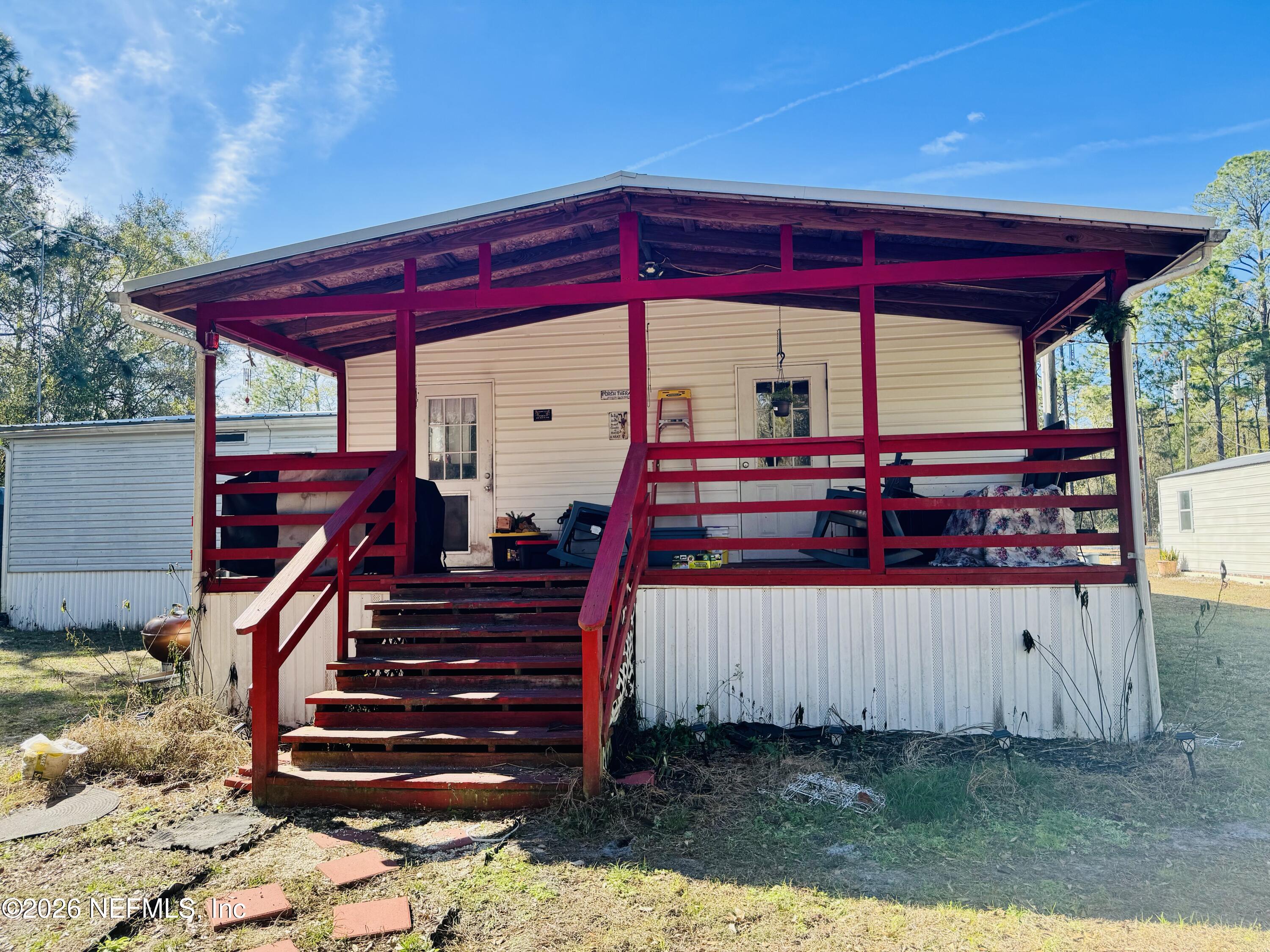 4700 Berry Court Keystone Heights, FL 32656 - Photo 55 of 65 a view of a deck with wooden fence