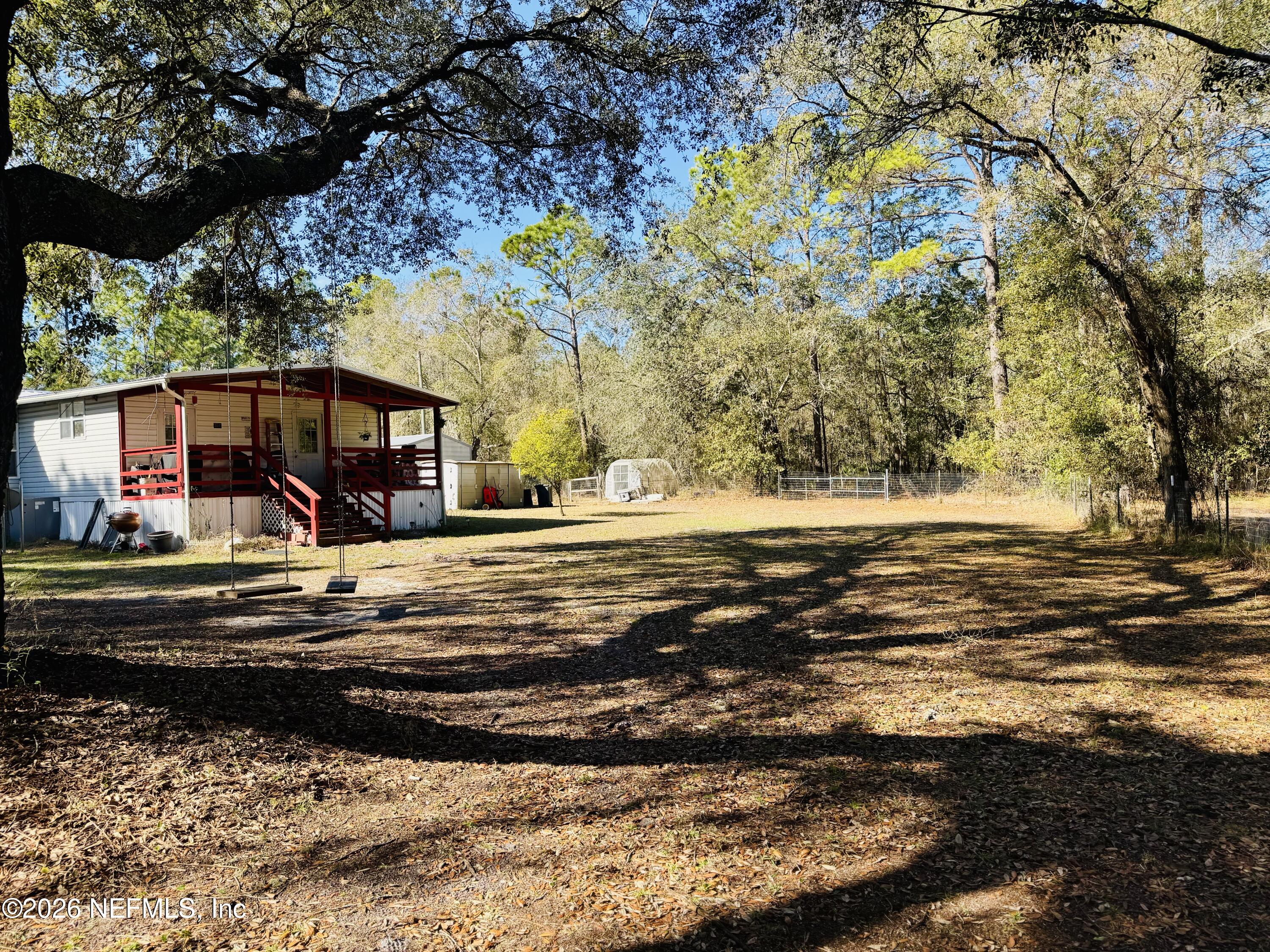 4700 Berry Court Keystone Heights, FL 32656 - Photo 60 of 65 a front view of a house with a big yard