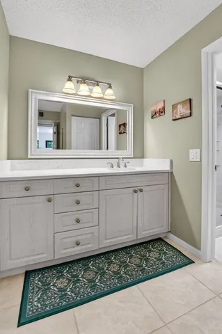a bathroom with a toilet a sink and shower