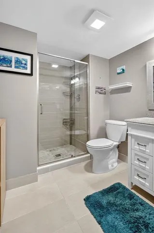 a bathroom with a sink a toilet and vanity