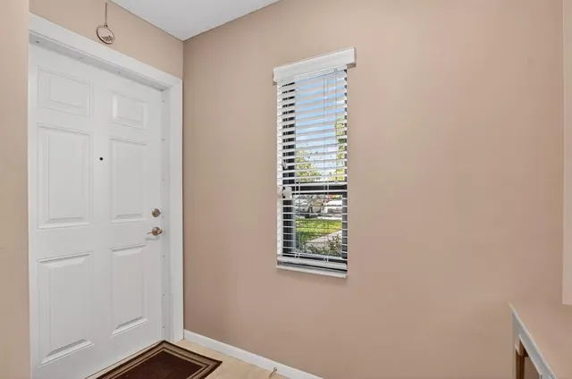 a view of an empty room with windows