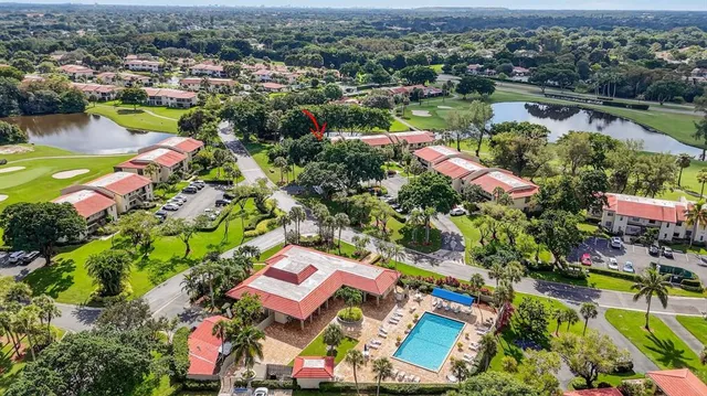 an aerial view of a house with a yard and balcony
