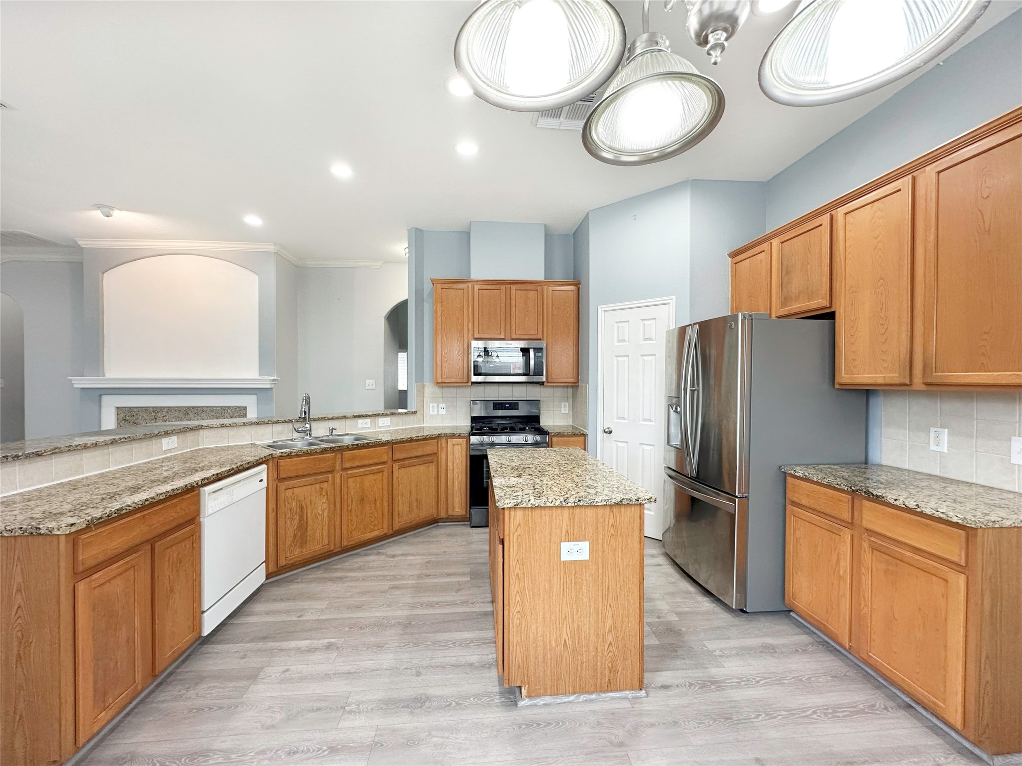 2910 Lemmingham Drive Spring, TX 77388 - Photo 12 of 31 a large kitchen with stainless steel appliances granite countertop a stove refrigerator and cabinets