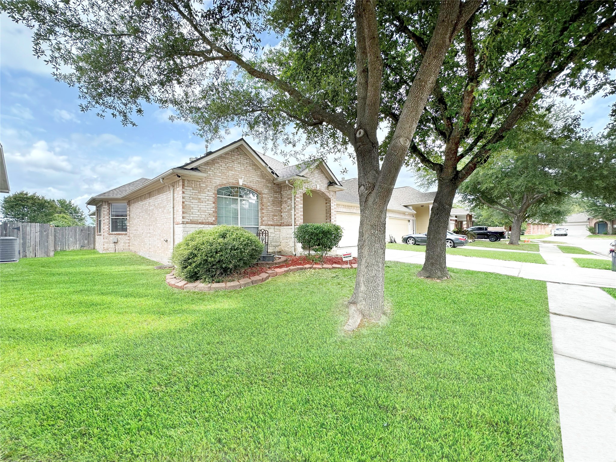 2910 Lemmingham Drive Spring, TX 77388 - Photo 2 of 31 a front view of a house with yard and green space