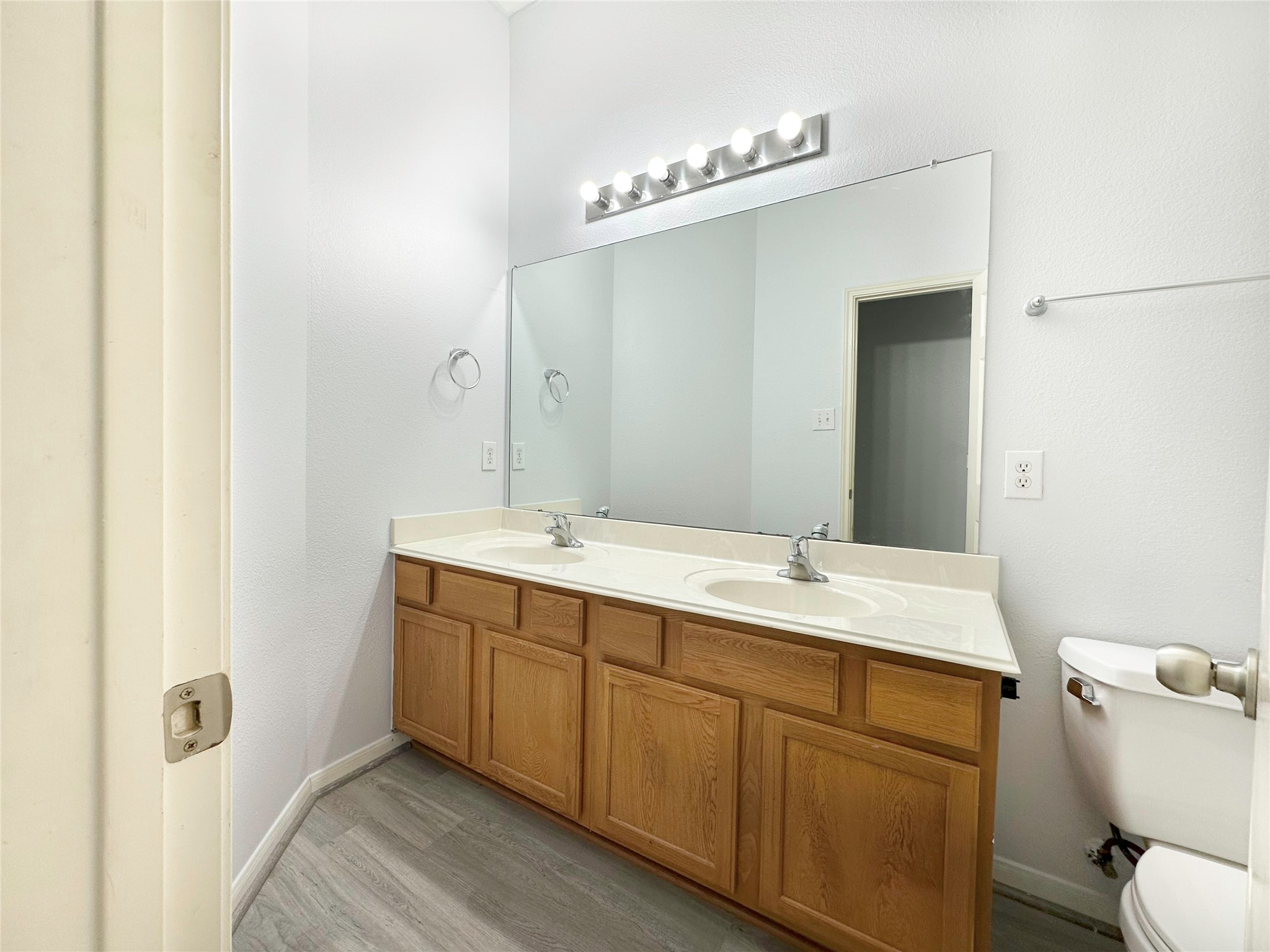 2910 Lemmingham Drive Spring, TX 77388 - Photo 21 of 31 a bathroom with a double vanity sink mirror and toilet