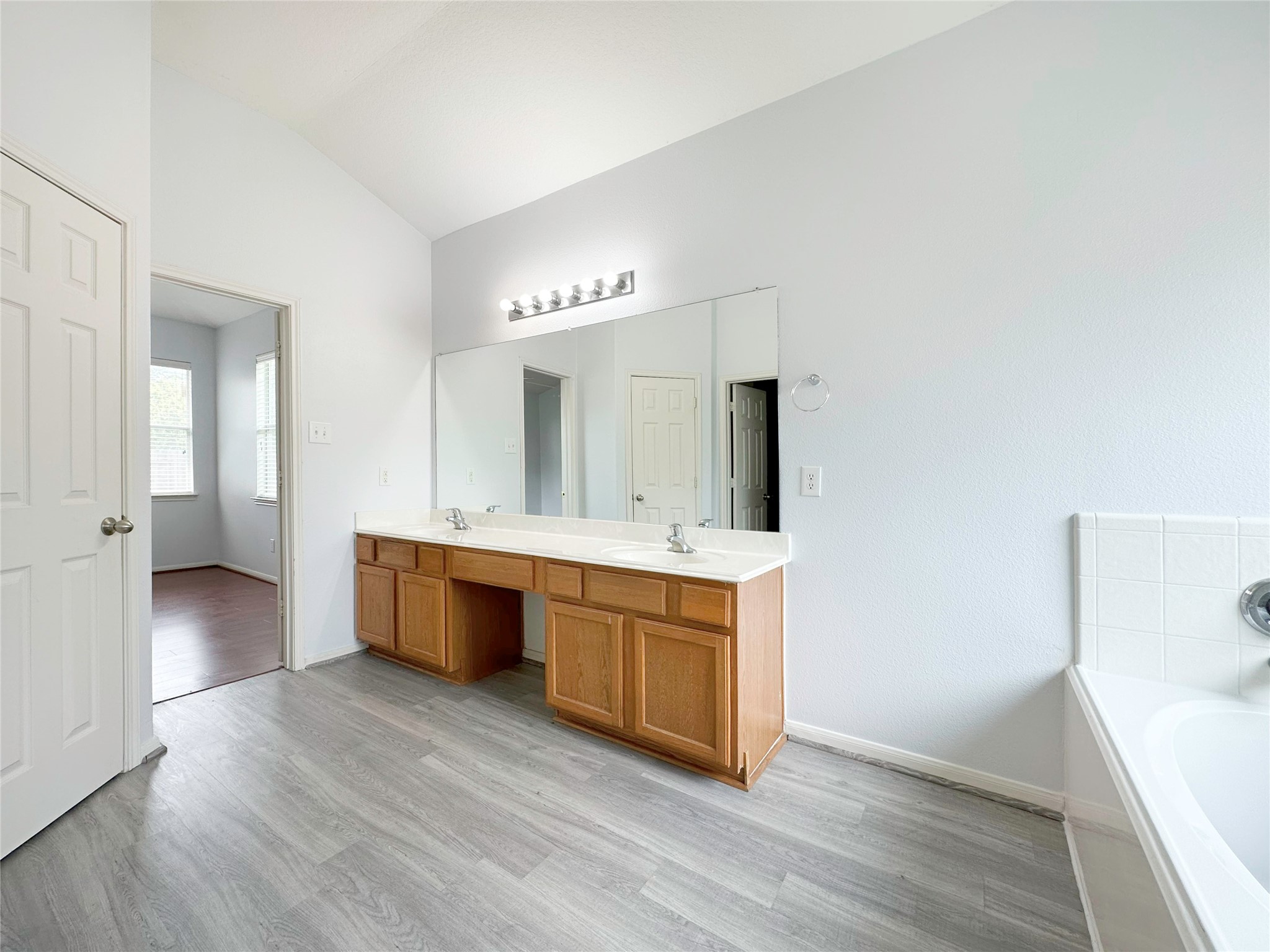2910 Lemmingham Drive Spring, TX 77388 - Photo 28 of 31 a large bathroom with a double vanity sink and mirror