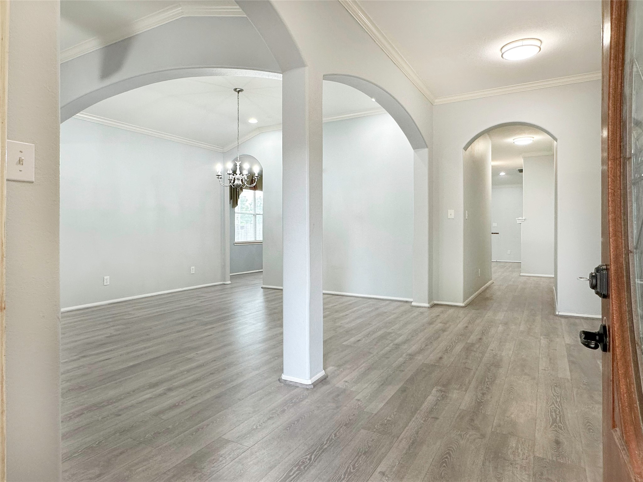 2910 Lemmingham Drive Spring, TX 77388 - Photo 4 of 31 an empty room with wooden floor and mirror
