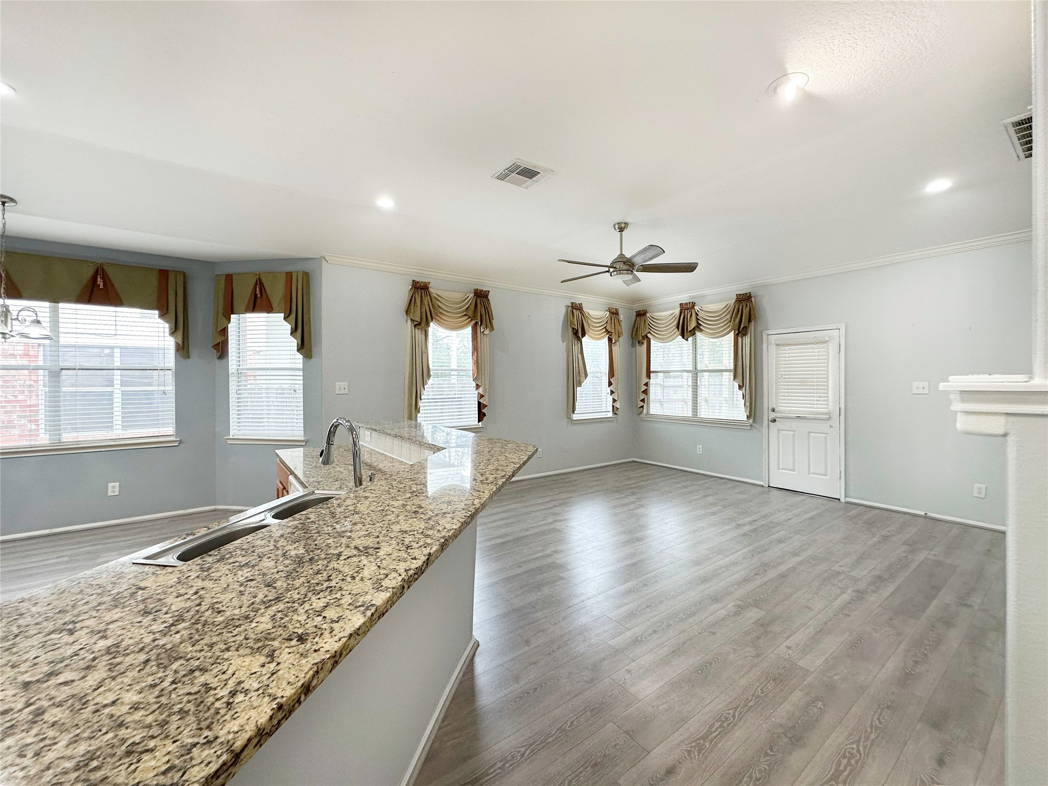 2910 Lemmingham Drive Spring, TX 77388 - Photo 8 of 31 a view of a kitchen island wooden floor and living room