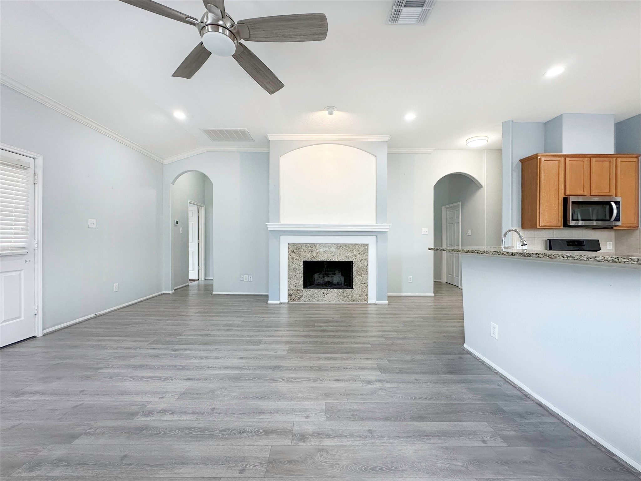 2910 Lemmingham Drive Spring, TX 77388 - Photo 10 of 31 a view of empty room with kitchen and fireplace