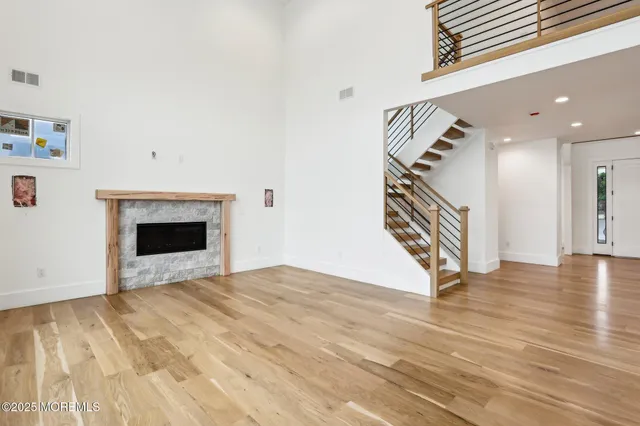 a view of a livingroom with furniture wooden floor and window