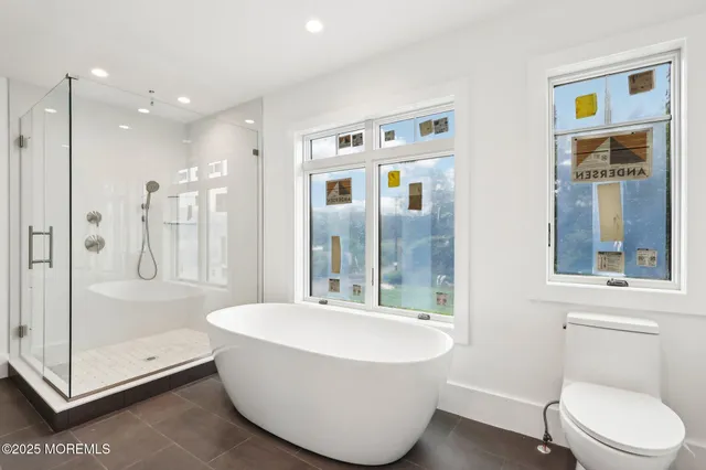 a view of a hallway with wooden floor and cabinet