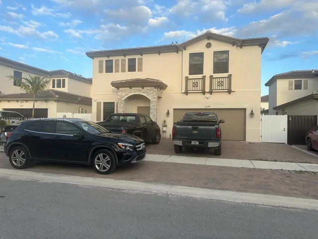a car parked in front of a house