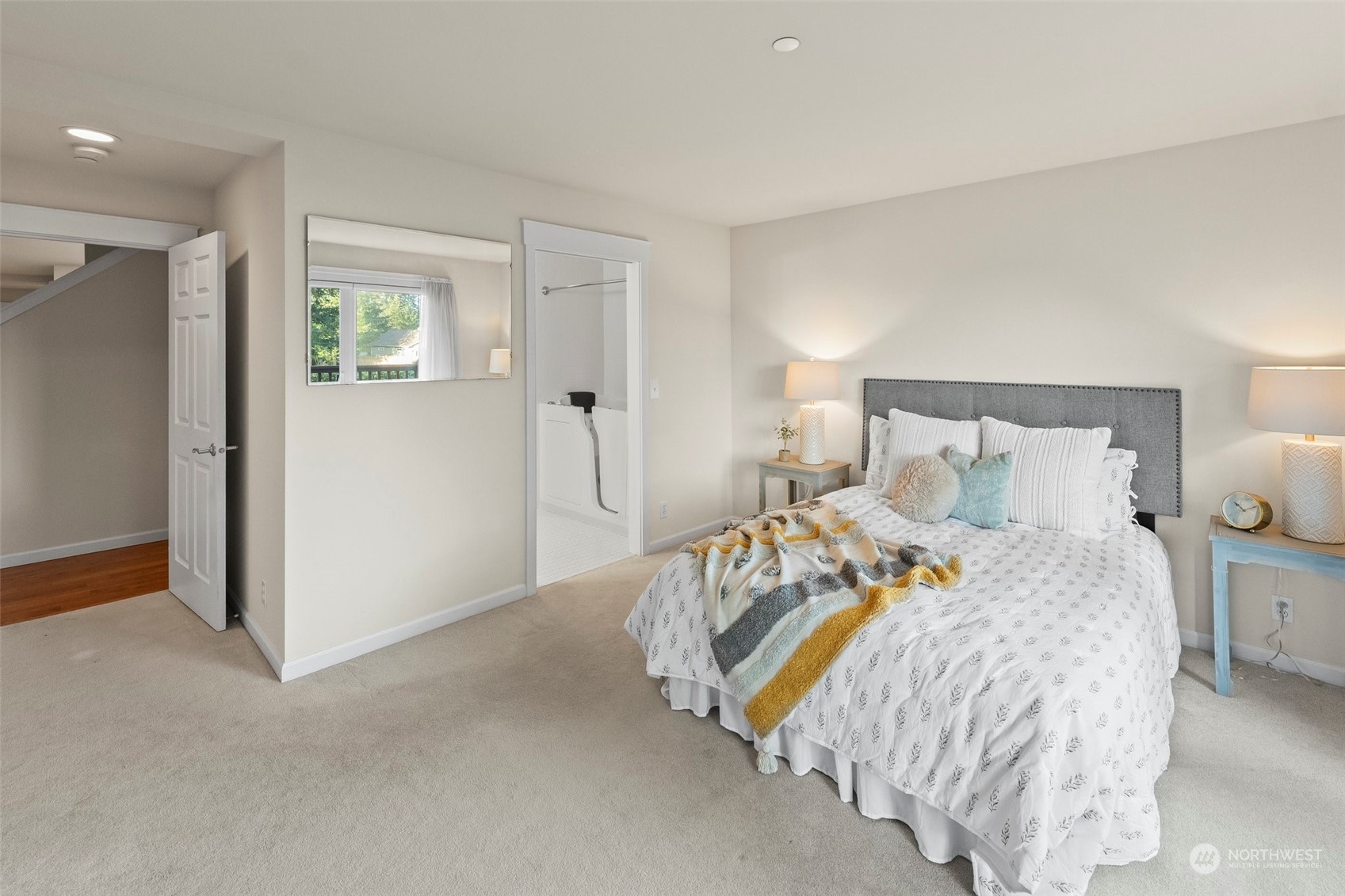 91 East Soderberg Road, Unit C8 Allyn, WA 98524 - Photo 21 of 39 a bedroom with a bed and lamp