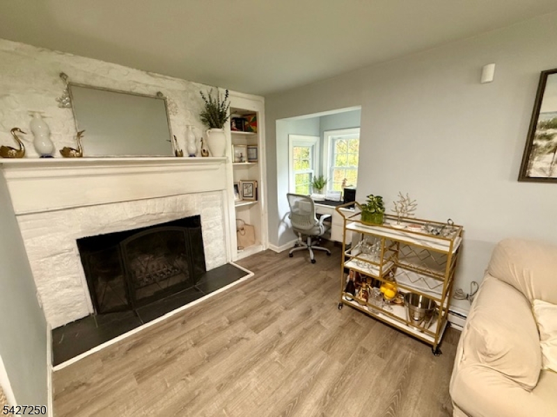 182 Stephensburg Road Port Murray, NJ 07865 - Photo 12 of 25 a living room with furniture and a fireplace