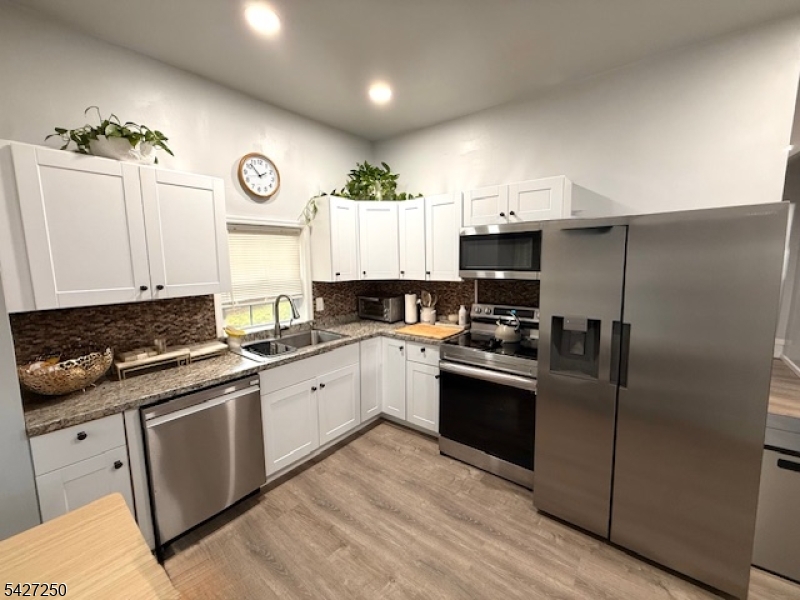 182 Stephensburg Road Port Murray, NJ 07865 - Photo 13 of 25 a kitchen with a sink stainless steel appliances and cabinets