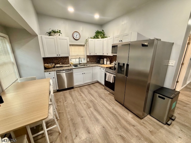 182 Stephensburg Road Port Murray, NJ 07865 - Photo 14 of 25 a kitchen with granite countertop a refrigerator stove and sink