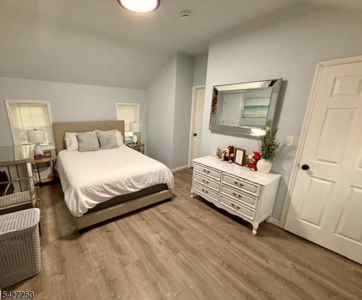 182 Stephensburg Road Port Murray, NJ 07865 - Photo 19 of 25 a bedroom with a bed and wooden floor