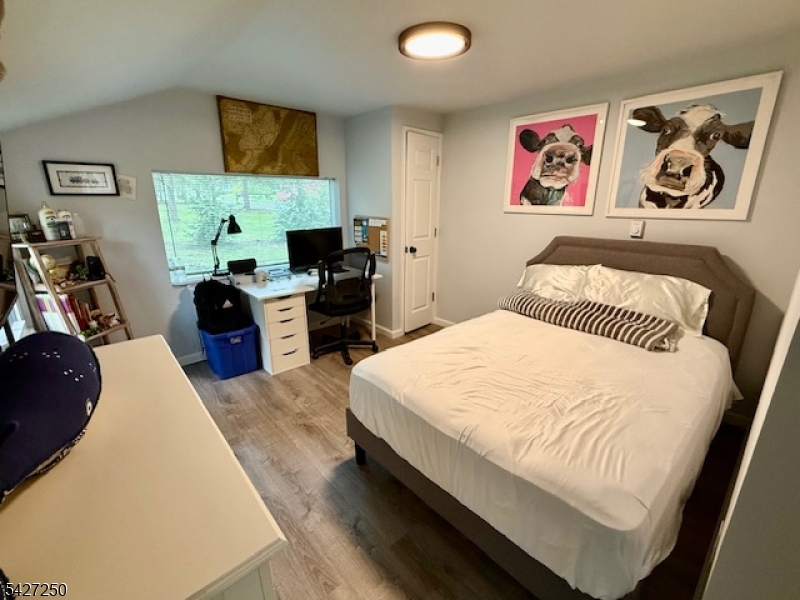 182 Stephensburg Road Port Murray, NJ 07865 - Photo 23 of 25 a bedroom with a bed and wooden floor