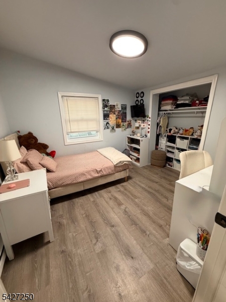 182 Stephensburg Road Port Murray, NJ 07865 - Photo 24 of 25 a bedroom with furniture and a wooden floor