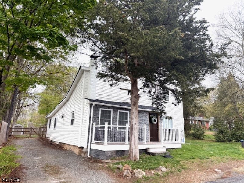 182 Stephensburg Road Port Murray, NJ 07865 - Photo 3 of 25 a view of a white house with a large tree and a yard