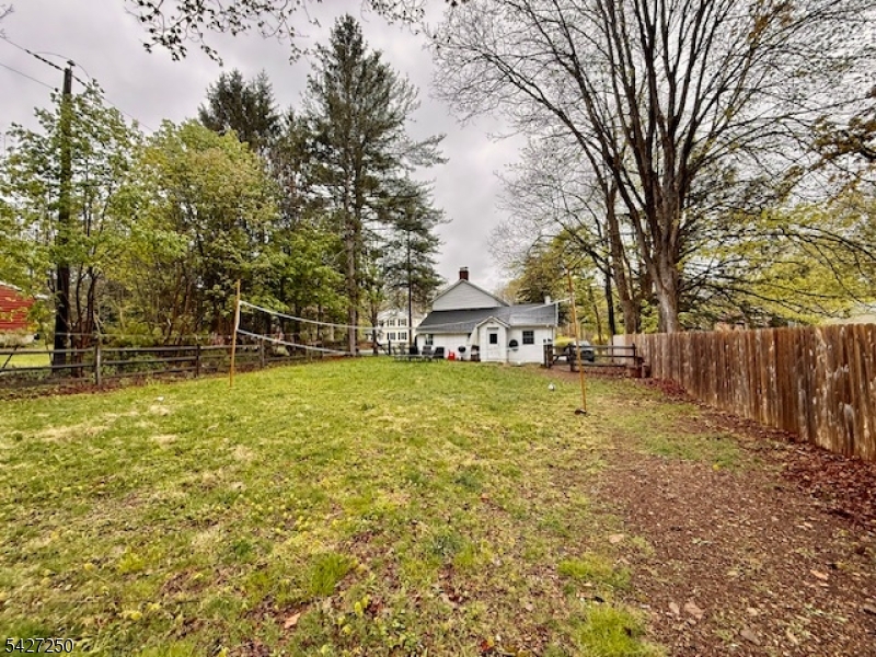 182 Stephensburg Road Port Murray, NJ 07865 - Photo 7 of 25 a view of a swimming pool with a bench and trees