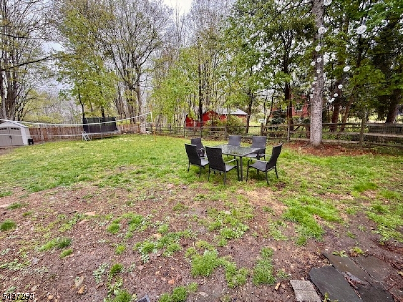 182 Stephensburg Road Port Murray, NJ 07865 - Photo 8 of 25 a view of a backyard with table and chairs potted plants and large tree