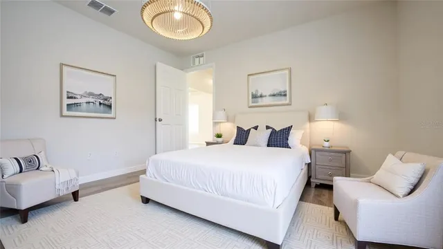 a bedroom with bed and a couch